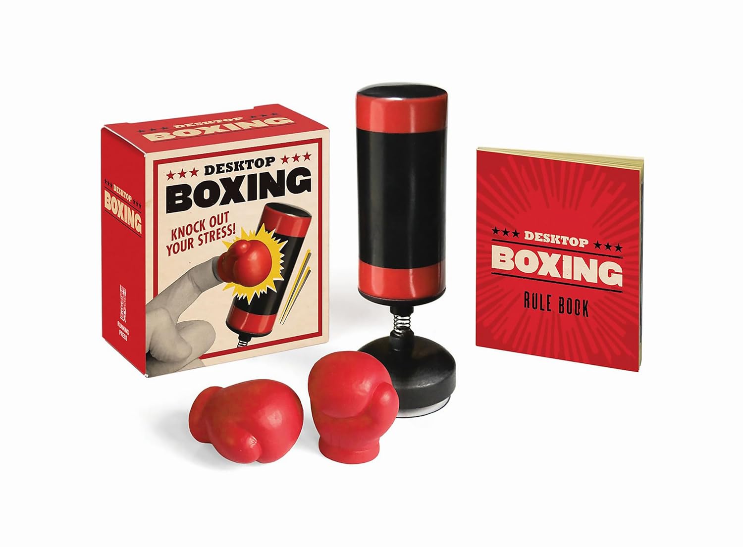 Desktop Boxing Kit

A novelty desktop boxing game set featuring a spring-mounted punching bag with red and black cylindrical design, two small red boxing glove hand pieces, an instruction rule book, and original packaging with "Knock Out Your Stress" branding.