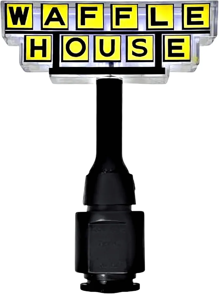 A novelty night light featuring a yellow and black illuminated sign replica reading "WAFFLE HOUSE" mounted on top of a black cylindrical base, designed to mimic the iconic restaurant's classic roadside signage.