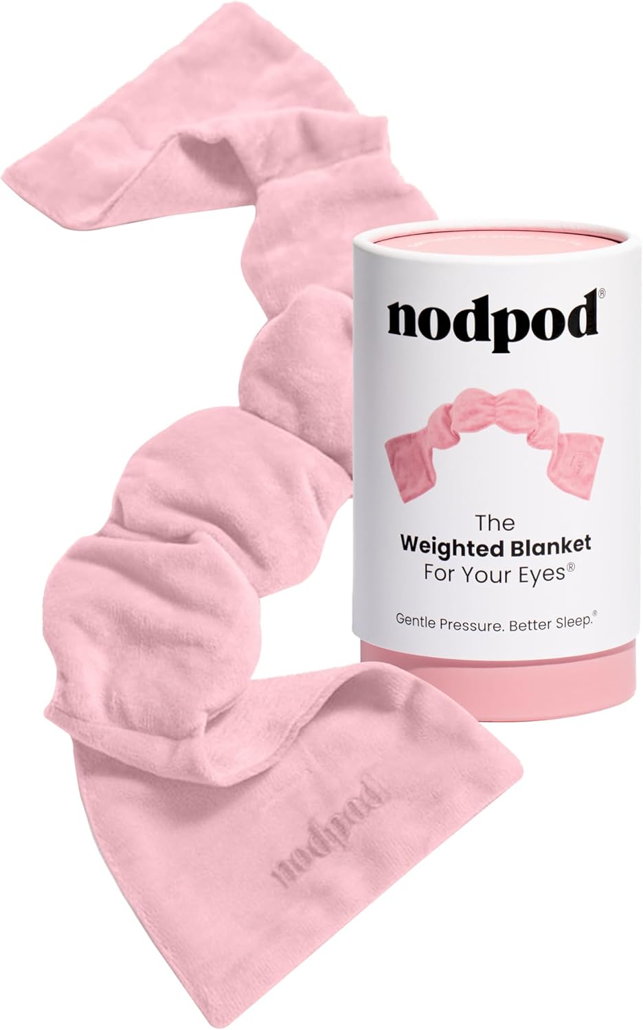 Nodpod weighted eye blanket displayed in pink with its product packaging. The soft, draped fabric demonstrates the gentle pressure design, accompanied by the branded cylindrical box showing the product name and tagline "Gentle Pressure. Better Sleep."